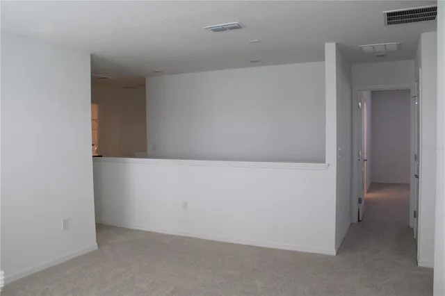 a view of a room with racks on the wall