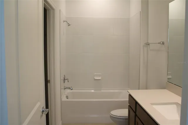 a view of a kitchen with a sink and a window