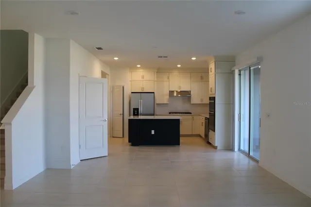 a kitchen with a sink a stove and refrigerator