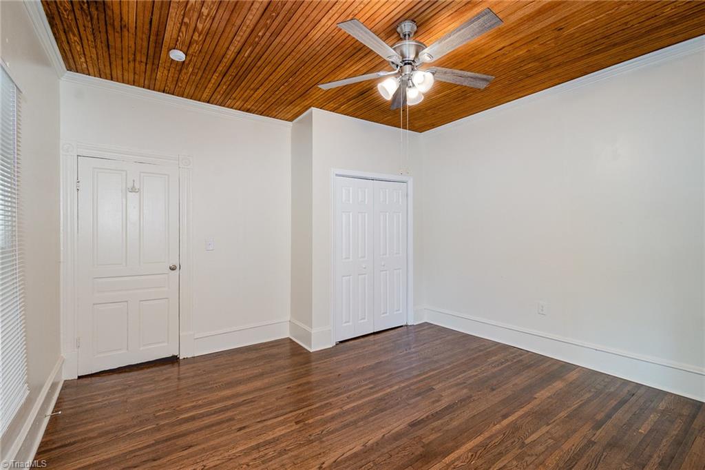 310 West Ray Avenue High Point, NC 27262 - Photo 18 of 28 Main level Primary Bedroom with ceiling fan and paneled ceiling.