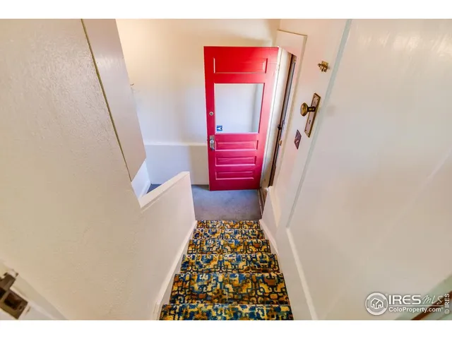 a view of a patio with table and chairs