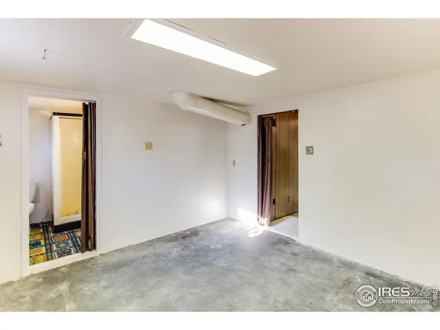 a bathroom with a toilet sink and a mirror