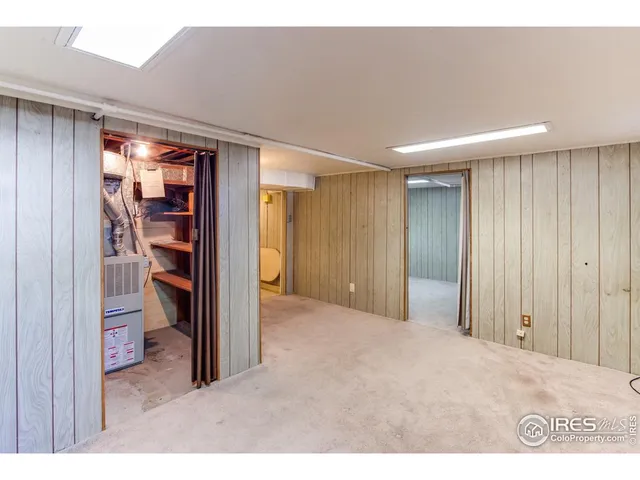 a view of empty room with furniture and cabinet
