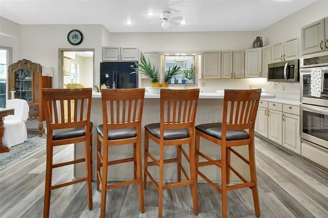 a view of an empty room with a fireplace and a window