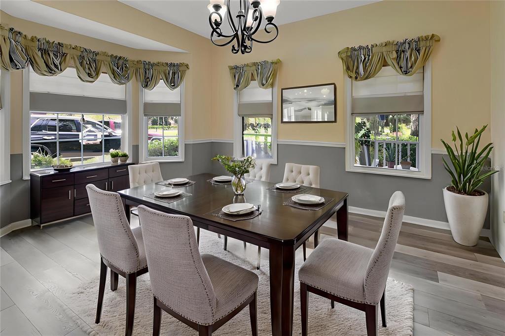 2236 River Ridge Road DeLand, FL 32720 - Photo 20 of 84 a view of a dining room with furniture and a large window