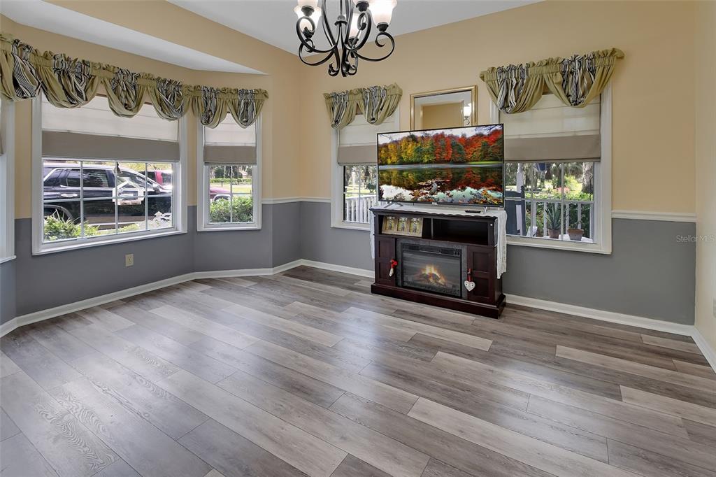 2236 River Ridge Road DeLand, FL 32720 - Photo 21 of 84 a view of an empty room with a fireplace and a window