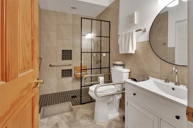 a utility room with cabinets washer and dryer