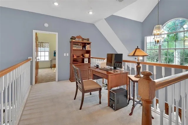 a view of a swimming pool with a patio and a patio