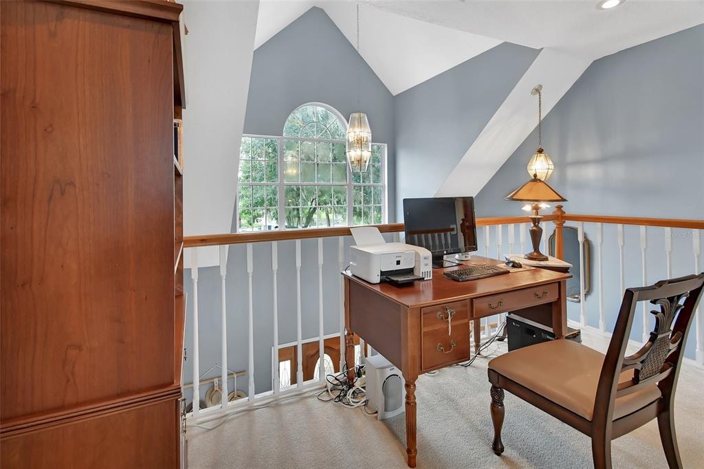 2236 River Ridge Road DeLand, FL 32720 - Photo 36 of 84 a view of a workspace with furniture and a window