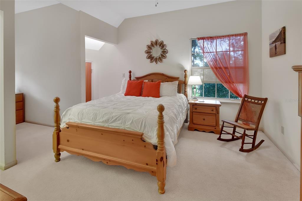 2236 River Ridge Road DeLand, FL 32720 - Photo 37 of 84 a bedroom with a bed chair and window
