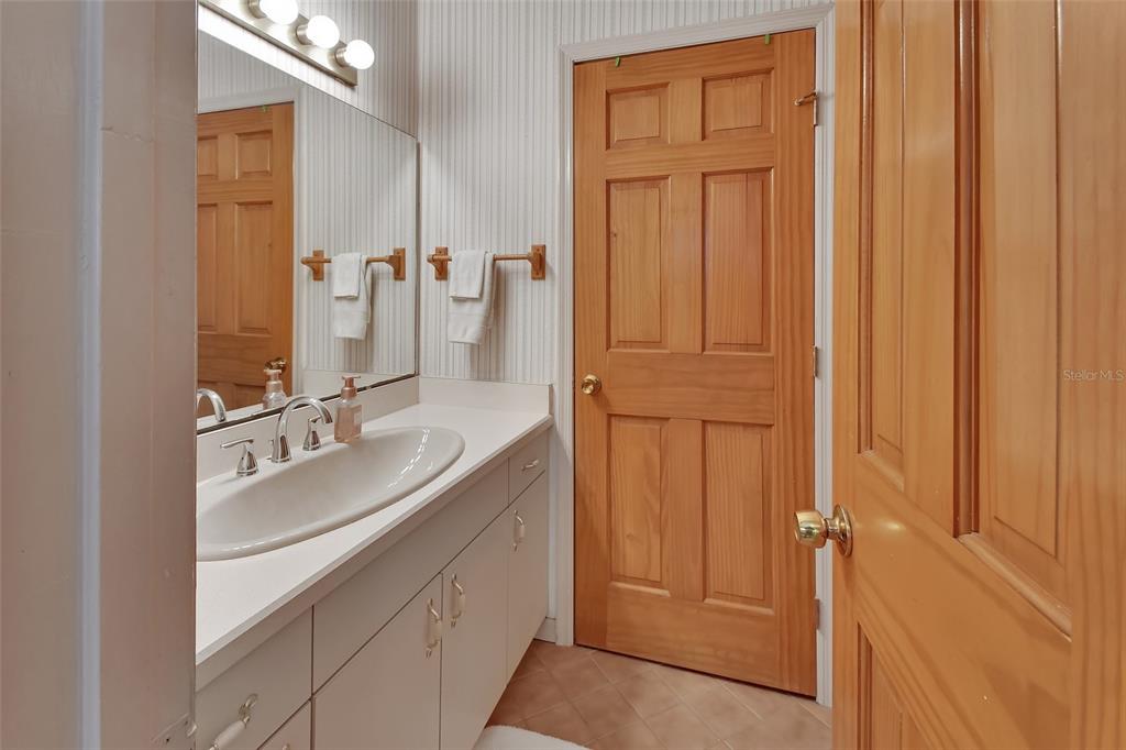2236 River Ridge Road DeLand, FL 32720 - Photo 40 of 84 a bathroom with a double vanity sink and a mirror