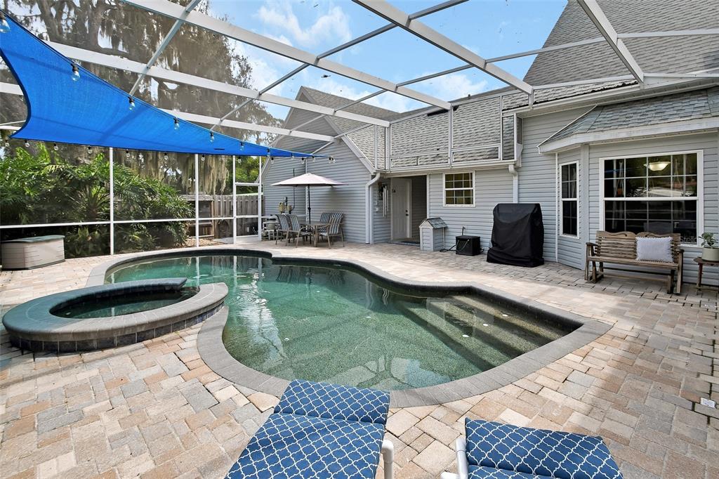2236 River Ridge Road DeLand, FL 32720 - Photo 50 of 84 a view of a swimming pool with a patio