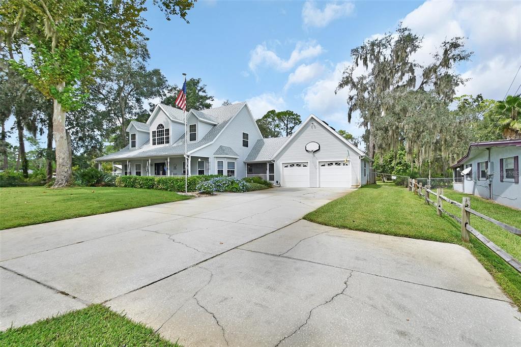 2236 River Ridge Road DeLand, FL 32720 - Photo 65 of 84 a front view of a house with garden