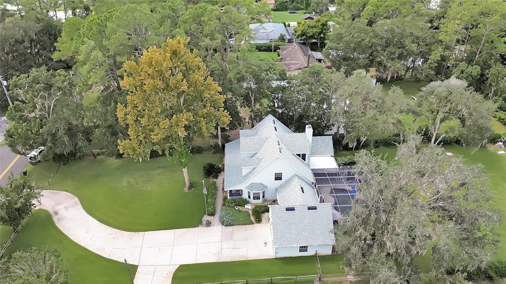 2236 River Ridge Road DeLand, FL 32720 - Photo 70 of 84 an aerial view of a house with outdoor space swimming pool and lake view