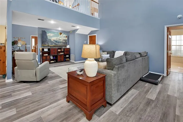 a view of living room with furniture and large window