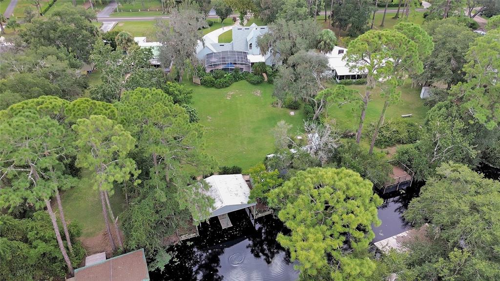 2236 River Ridge Road DeLand, FL 32720 - Photo 72 of 84 a aerial view of a house with a yard
