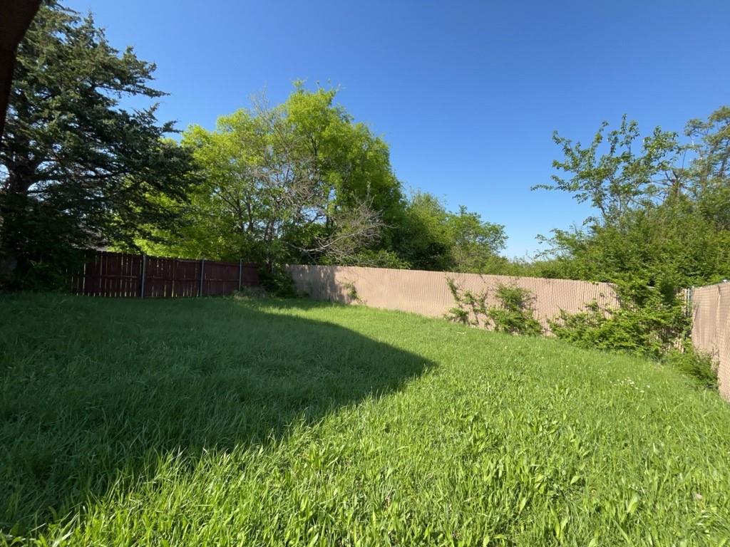 2511 Kavasar Drive Dallas, TX 75241 - Photo 2 of 5 a view of yard with grass and trees