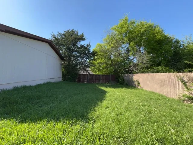 a view of backyard with green space