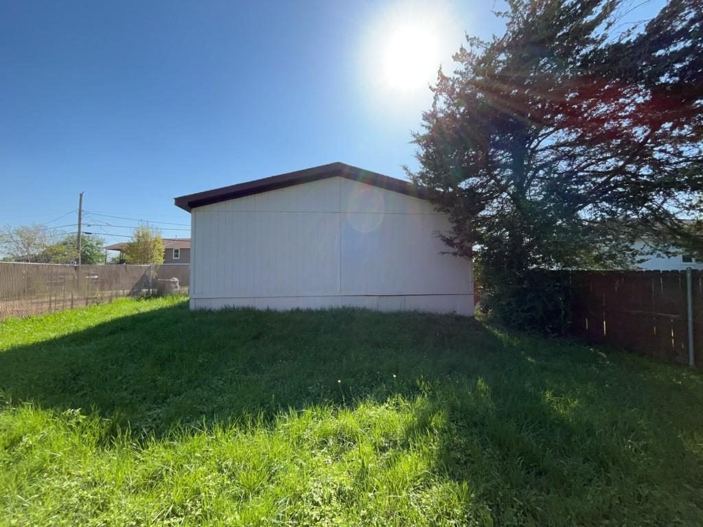 2511 Kavasar Drive Dallas, TX 75241 - Photo 5 of 5 a backyard of a house with lots of green space