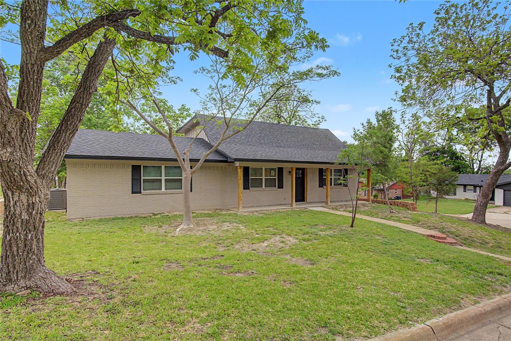 502 Rogers Way Rockwall, TX 75087 - Photo 1 of 23 a front view of a house with a garden