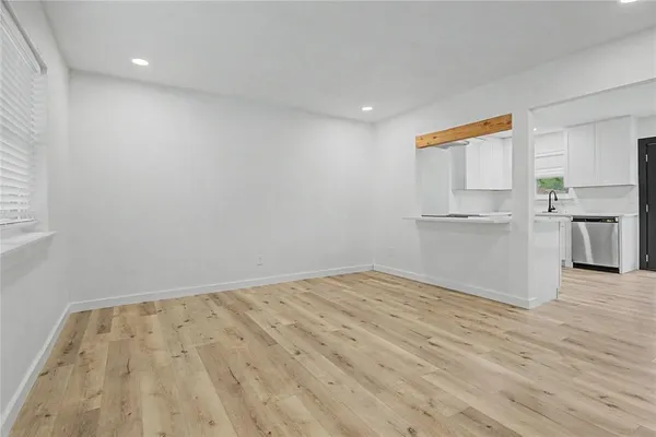 a kitchen with stainless steel appliances granite countertop a refrigerator and a stove