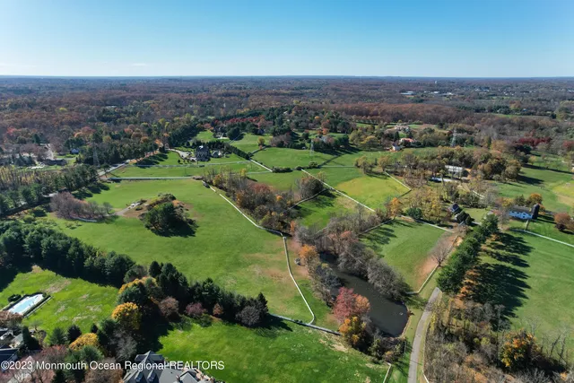 an aerial view of a houses with a yard