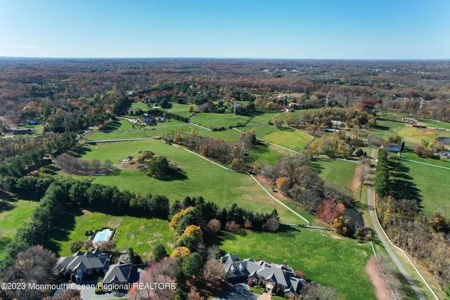 an aerial view of a golf course with parking space