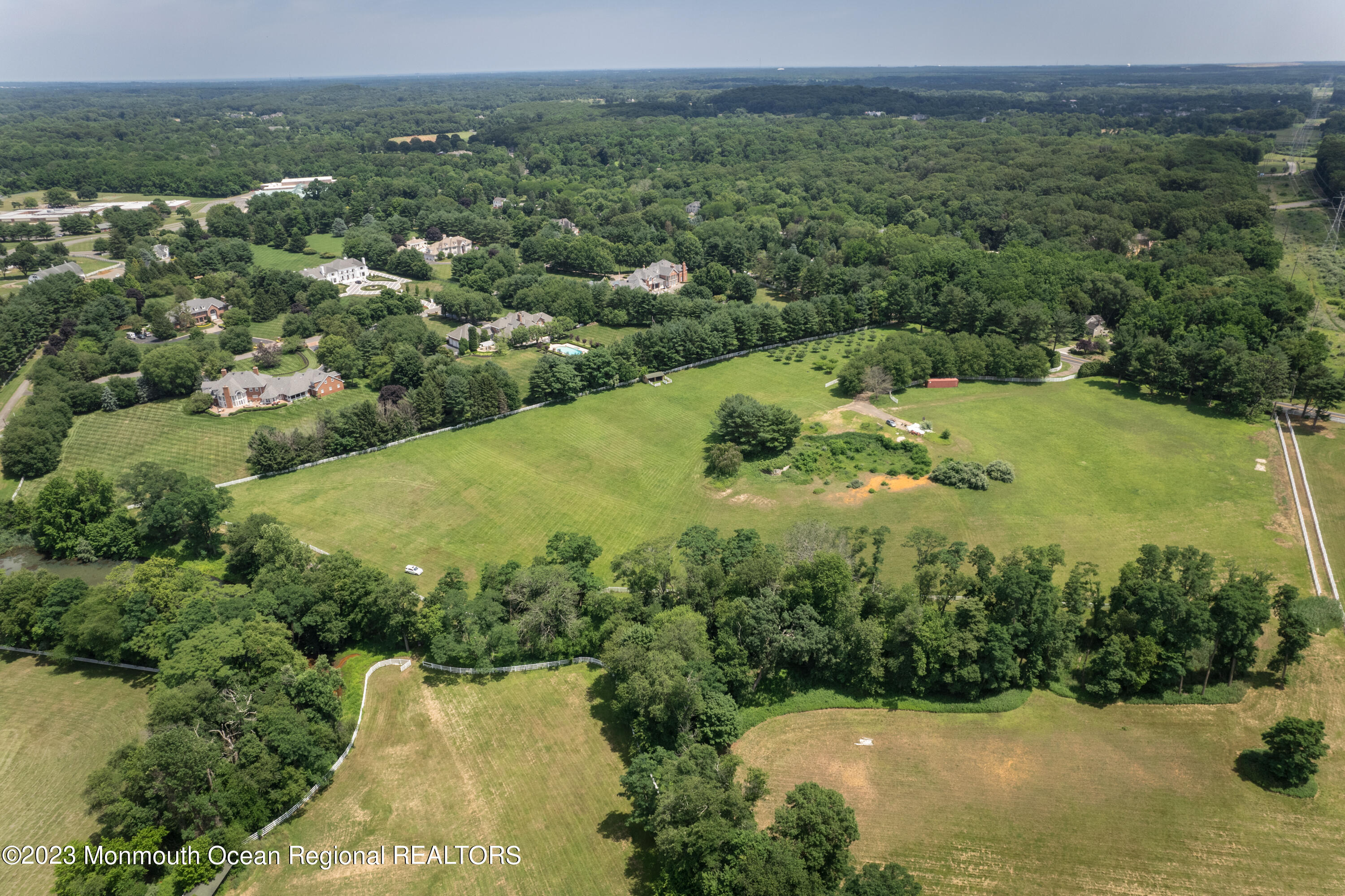 55 Crine Road Colts Neck, NJ 07722 - Photo 3 of 28 a view of a lake with a city