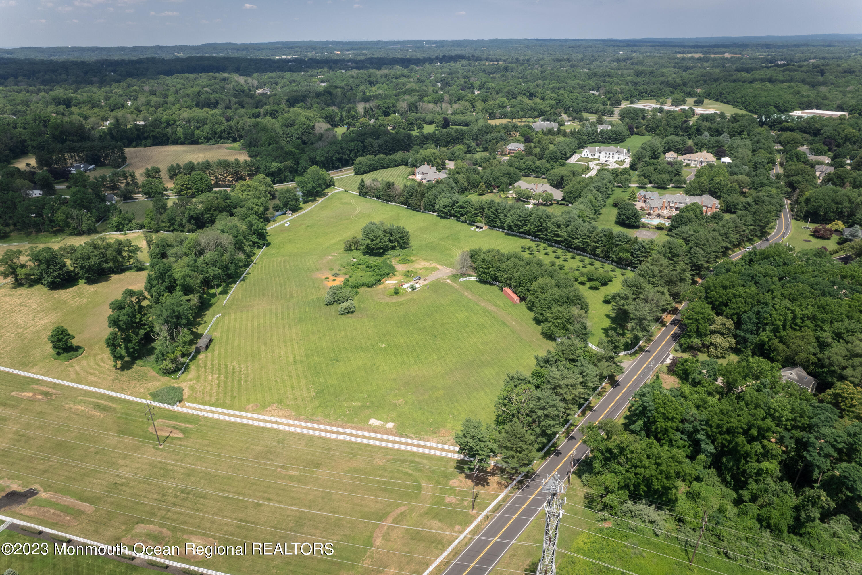 55 Crine Road Colts Neck, NJ 07722 - Photo 5 of 28 an aerial view of residential houses with outdoor space and trees
