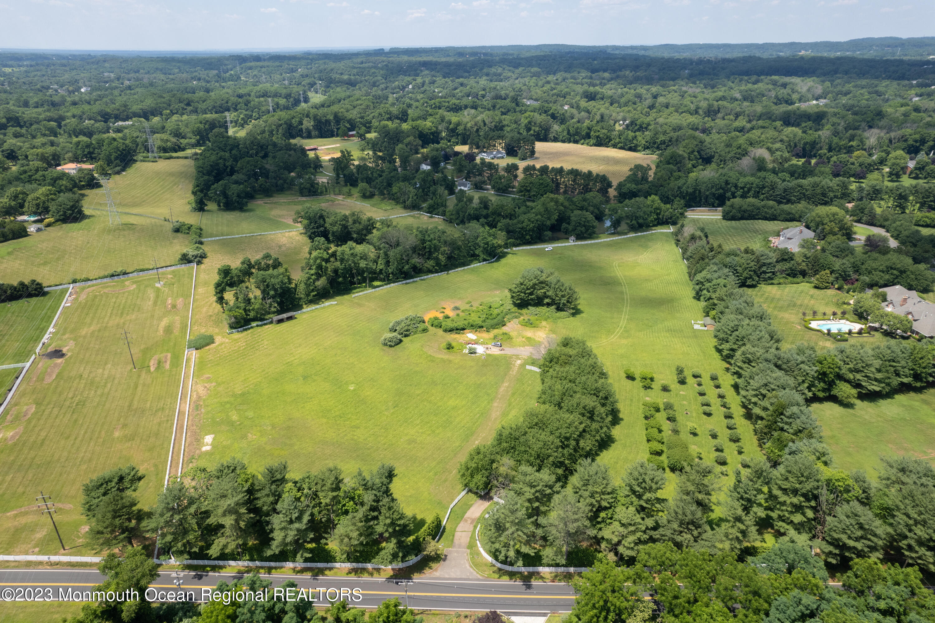 55 Crine Road Colts Neck, NJ 07722 - Photo 7 of 28 an aerial view of residential houses with outdoor space and trees