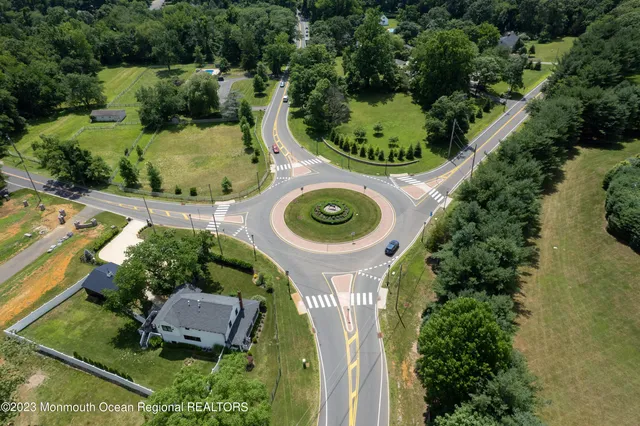an aerial view of a house with outdoor space and street view