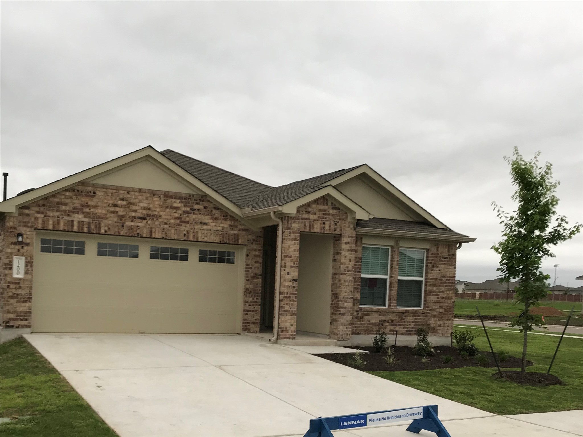 1200 Nokota Bend Georgetown, TX 78626 - Photo 1 of 39 a front view of house with yard and trees around