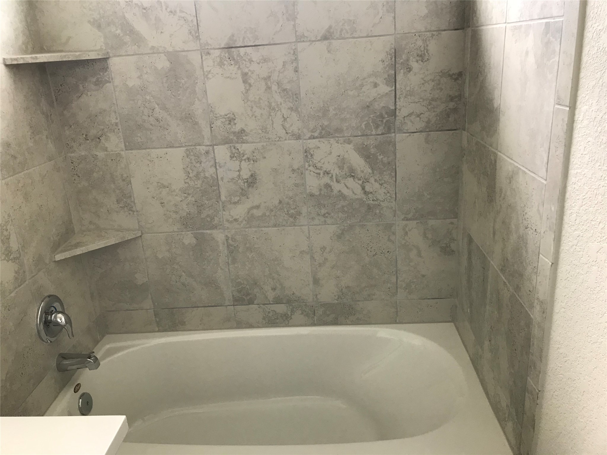 1200 Nokota Bend Georgetown, TX 78626 - Photo 7 of 39 a bath tub sitting next to a white sink and a shower