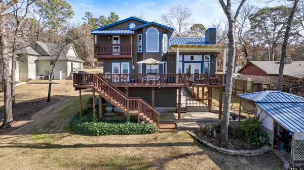 a view of balcony with wooden floor and outdoor seating