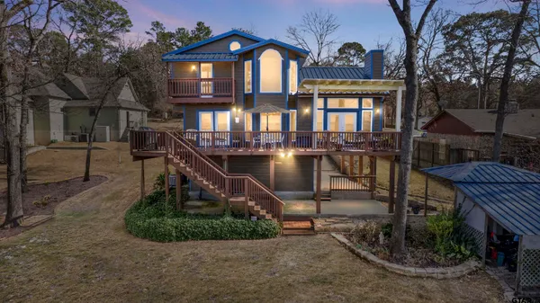 a view of a chairs and table on the deck
