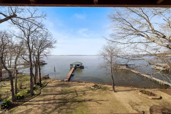 a view of a patio with iron fence