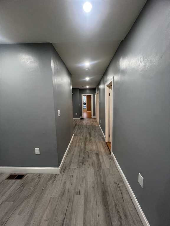 10 Essex Street, Unit 1 Brockton, MA 02301 - Photo 6 of 10 a view of hallway with wooden floor