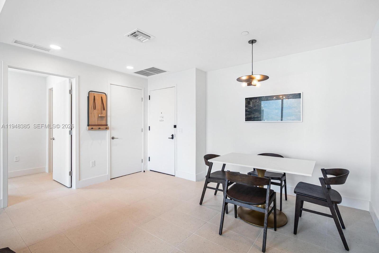 159 Northeast 6th Street, Unit 5101 Miami, FL 33132 - Photo 12 of 47 a workspace with furniture and window