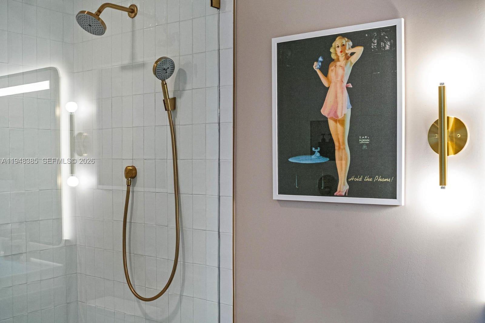 159 Northeast 6th Street, Unit 5101 Miami, FL 33132 - Photo 18 of 47 a bathroom with a mirror and a shower