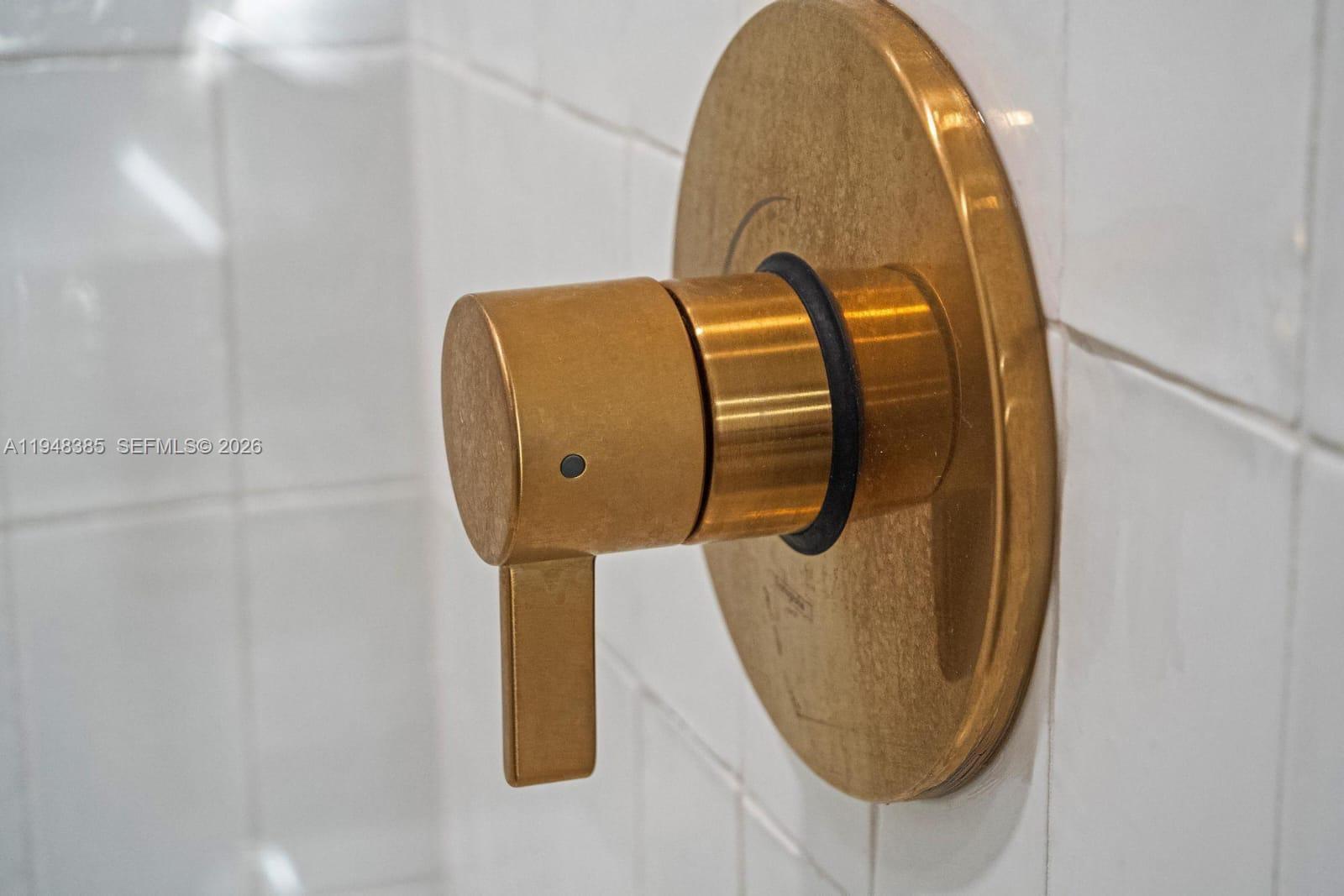 159 Northeast 6th Street, Unit 5101 Miami, FL 33132 - Photo 19 of 47 a bathroom with a mirror and vanity