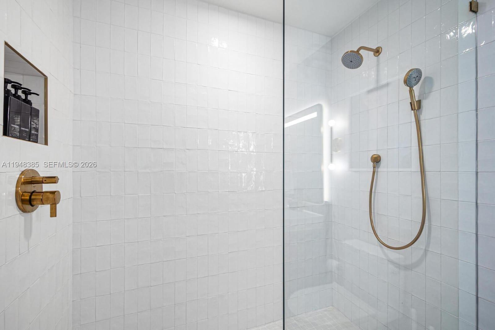 159 Northeast 6th Street, Unit 5101 Miami, FL 33132 - Photo 21 of 47 a bathroom with a shower