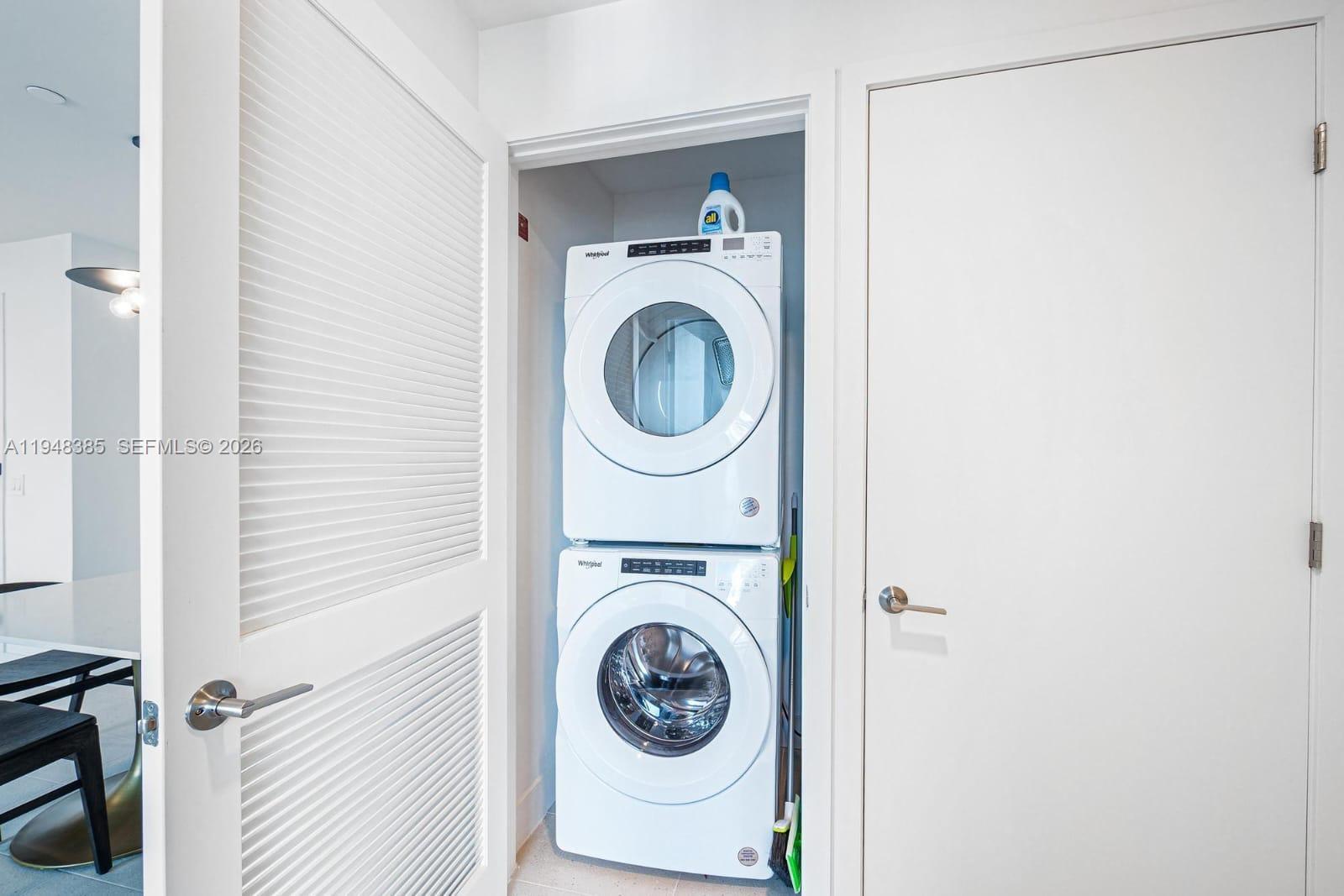 159 Northeast 6th Street, Unit 5101 Miami, FL 33132 - Photo 38 of 47 a utility room with dryer and washer