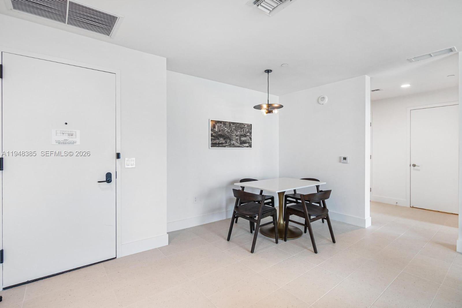 159 Northeast 6th Street, Unit 5101 Miami, FL 33132 - Photo 47 of 47 a view of a dining room with furniture