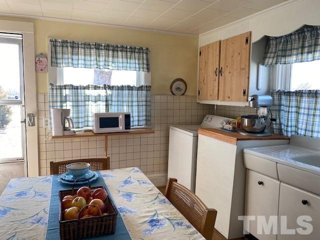 871 Halifax Road Roxboro, NC 27573 - Photo 20 of 45 a kitchen with a sink and a refrigerator