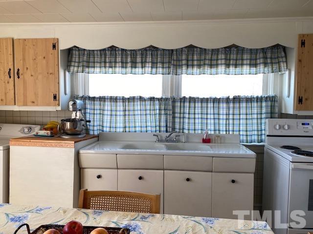 871 Halifax Road Roxboro, NC 27573 - Photo 21 of 45 a view of kitchen sink and cabinet