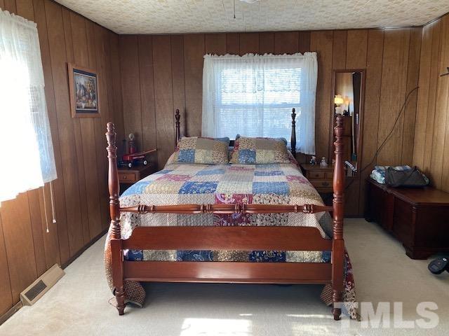 871 Halifax Road Roxboro, NC 27573 - Photo 23 of 45 a bed sitting in a bedroom next to a window