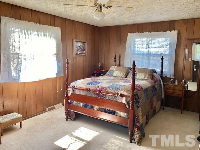 871 Halifax Road Roxboro, NC 27573 - Photo 24 of 45 a bedroom with a bed and window