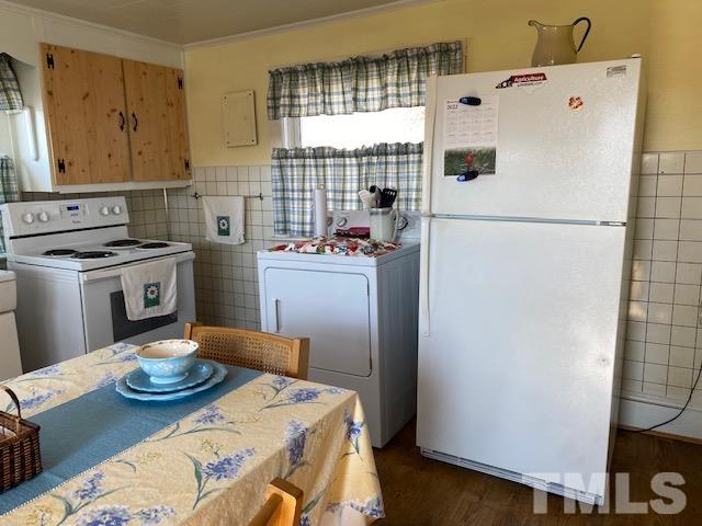 871 Halifax Road Roxboro, NC 27573 - Photo 25 of 45 a kitchen with stainless steel appliances granite countertop a refrigerator a sink dishwasher a stove with wooden floor