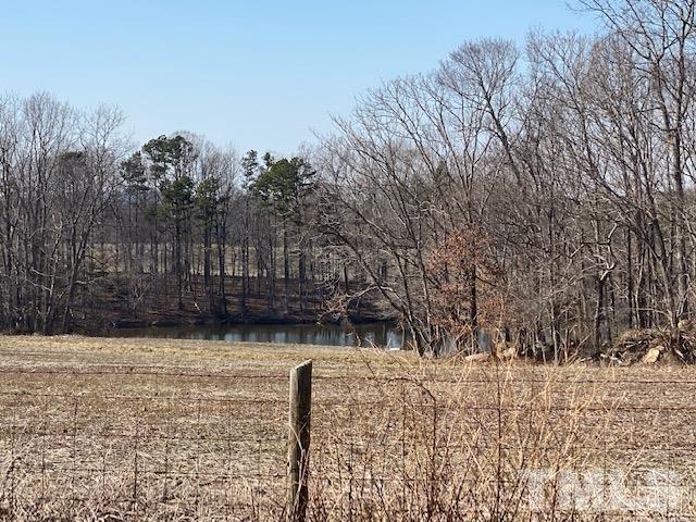 871 Halifax Road Roxboro, NC 27573 - Photo 31 of 45 a street view with wooden fence