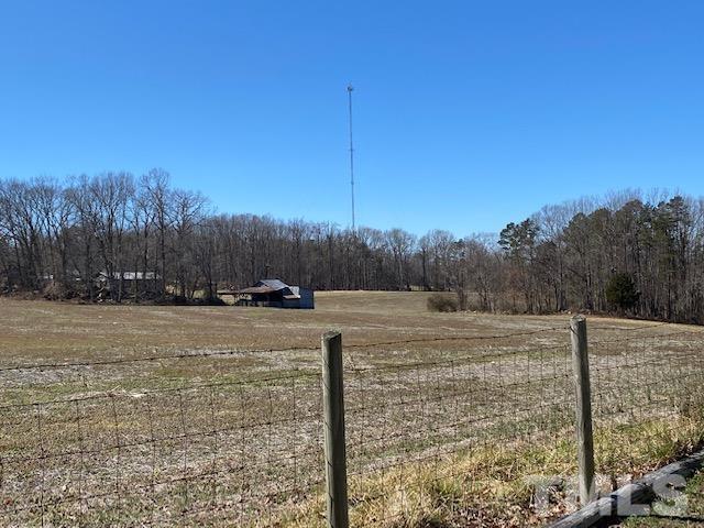 871 Halifax Road Roxboro, NC 27573 - Photo 34 of 45 a view of a yard with a tree